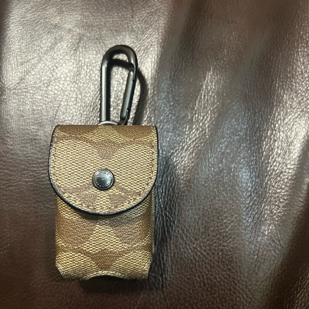 Coach khaki Signature Canvas airPods case bag charm with Black Carabiner
